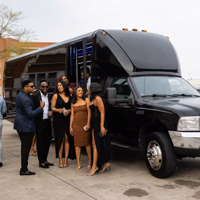 Passengers loading luggage while boarding an Coral Springs group shuttle