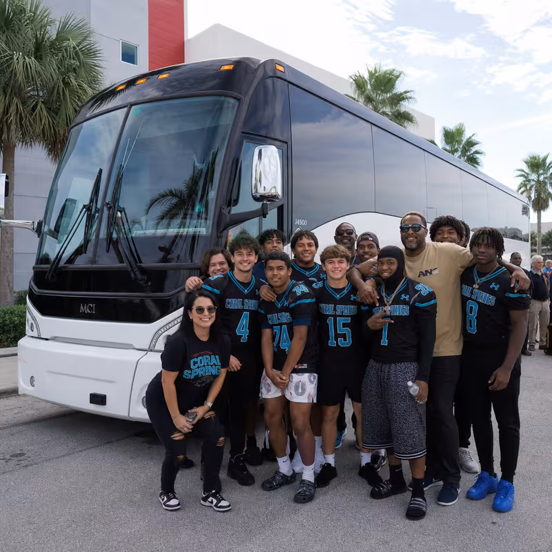 Passengers loading luggage while boarding an Coral Springs group shuttle